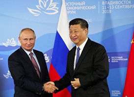 Президент РФ Владимир Путин и председатель КНР Си Цзиньпин (справа), 11 сентября 2018